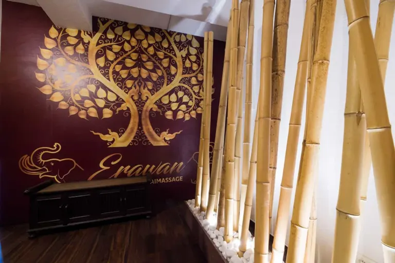 Golden tree mural with Erawan lettering and bamboo in the massage studio in Frankfurt-Schwanheim
